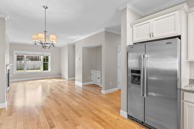 4 Emerald Way Unit 4, Salisbury, MA 01952 - kitchen with high end fridge, white cabinetry, a chandelier, ornamental molding, and light wood-type flooring