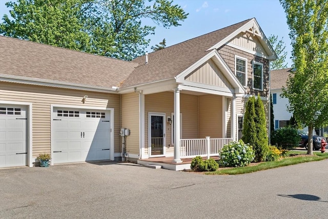 4 Emerald Way Unit 4, Salisbury, MA 01952 - view of front of home featuring board and batten siding, asphalt driveway, a garage, and roof with shingles
