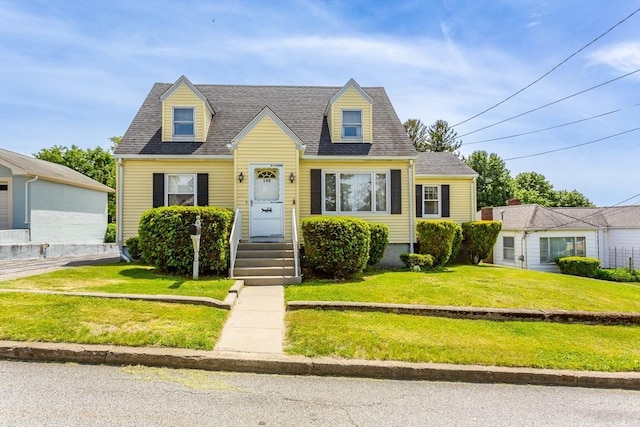 195 Hooper St, Tiverton, RI 02878 - new england style home with a front yard and roof with shingles