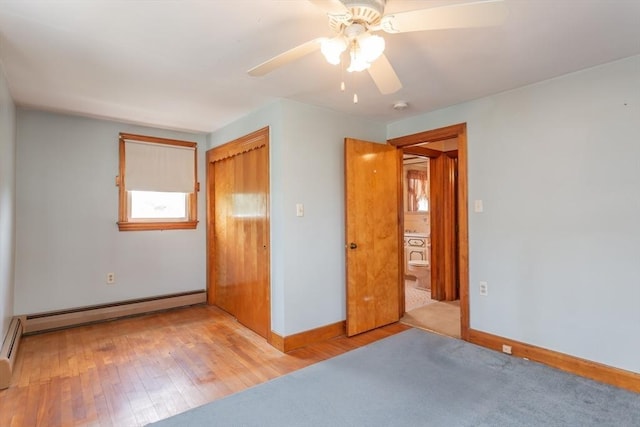195 Hooper St, Tiverton, RI 02878 - unfurnished bedroom featuring a baseboard radiator, baseboards, a closet, and light wood-style floors