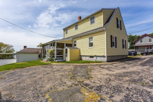 195 Hooper St, Tiverton, RI 02878 - back of property featuring a chimney