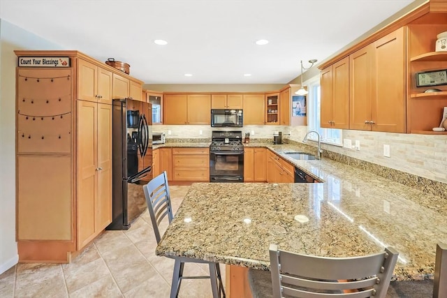 kitchen featuring a peninsula, open shelves, a sink, decorative backsplash, and black appliances