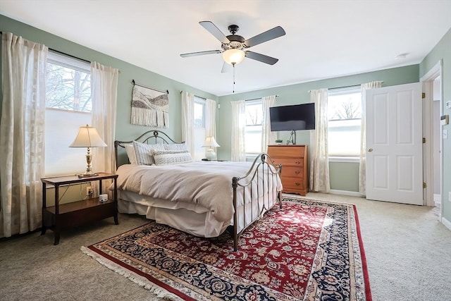 bedroom featuring a ceiling fan, carpet, and baseboards