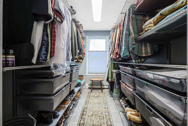 walk in closet featuring a baseboard heating unit