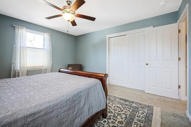 bedroom featuring a closet, a ceiling fan, and carpet