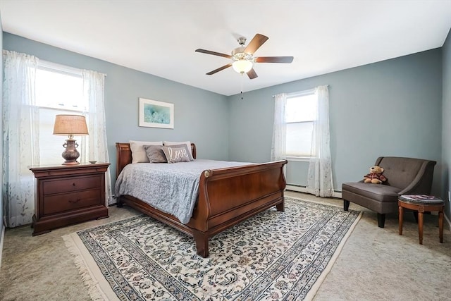 bedroom with light colored carpet and ceiling fan