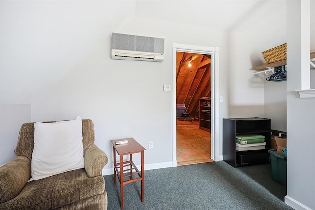 living area with dark colored carpet, baseboards, and an AC wall unit