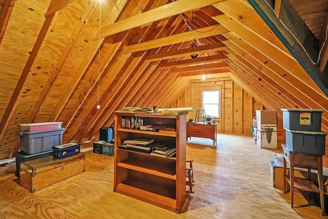 unfinished attic featuring an upstairs landing