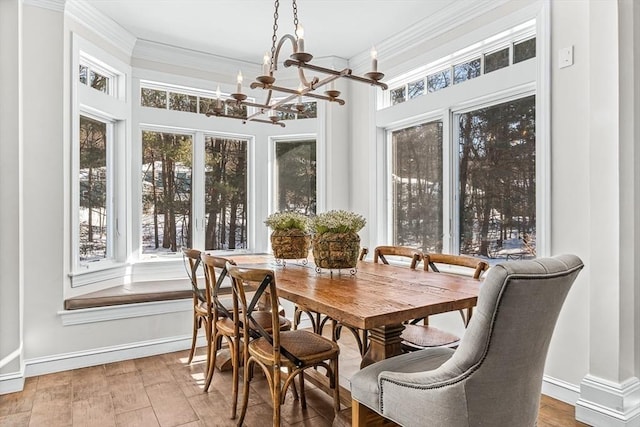 sunroom / solarium with a notable chandelier