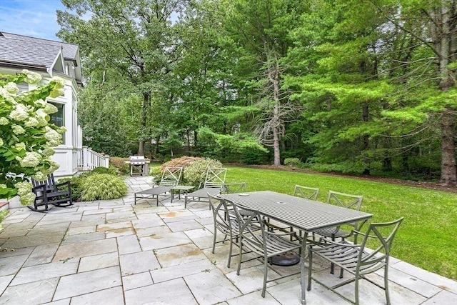 view of patio with outdoor dining space and area for grilling