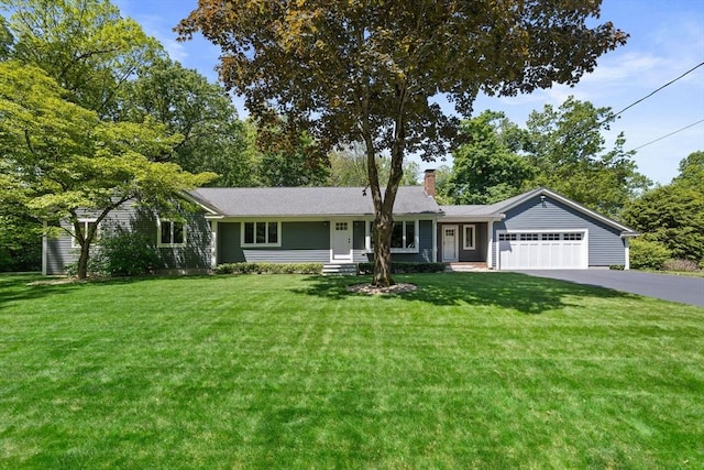 225 Union St, Mansfield, MA 02048 - ranch-style home with asphalt driveway, a chimney, an attached garage, and a front yard