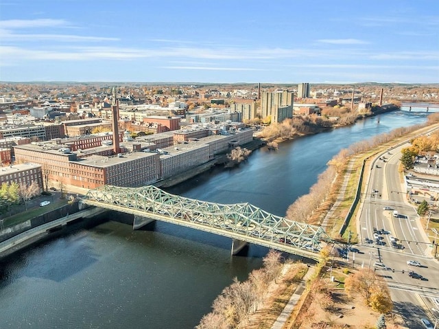drone / aerial view with a city view and a water view