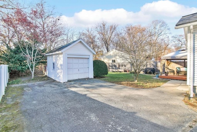 garage featuring a lawn