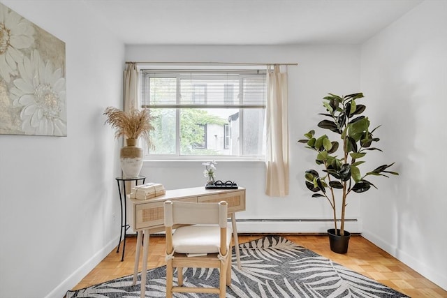 sitting room featuring parquet flooring and a baseboard heating unit