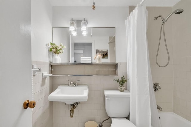 full bathroom featuring toilet, tile walls, sink, and shower / bath combination with curtain