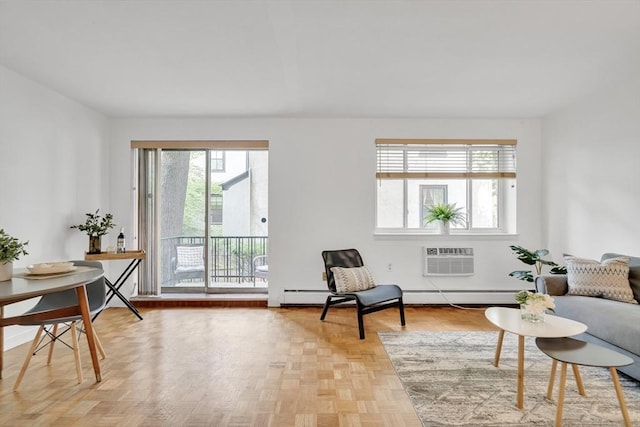 living area featuring light parquet flooring and an AC wall unit