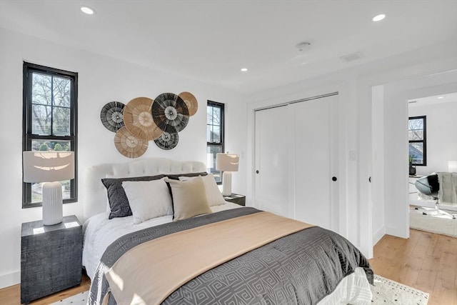 bedroom with light wood-type flooring