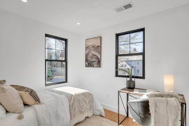 bedroom with hardwood / wood-style flooring