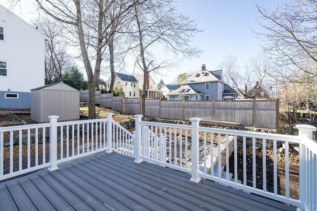 wooden terrace featuring a storage shed