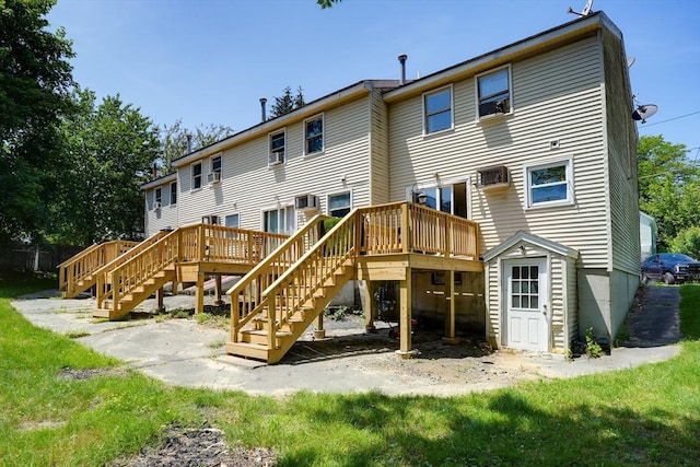 25 Sutherland St, Lowell, MA 01850 - rear view of house with stairway and a wooden deck