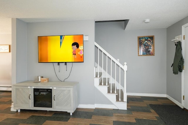 25 Sutherland St, Lowell, MA 01850 - interior space featuring a baseboard radiator, stairs, and wood finished floors