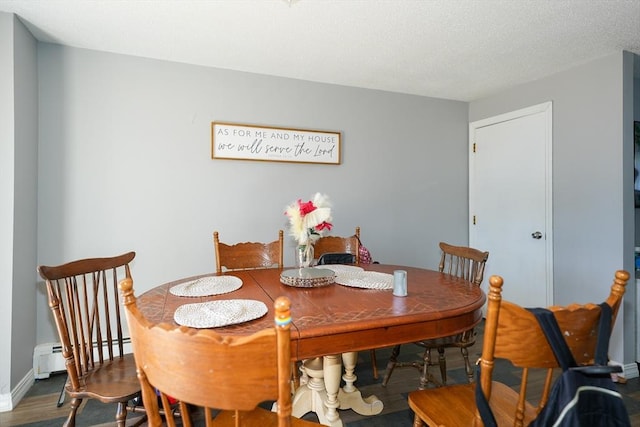 25 Sutherland St, Lowell, MA 01850 - dining room with a baseboard heating unit and wood finished floors
