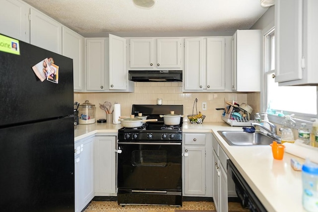 25 Sutherland St, Lowell, MA 01850 - kitchen featuring black appliances, under cabinet range hood, light countertops, white cabinetry, and a textured ceiling