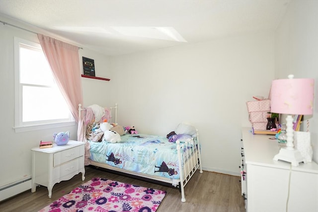 25 Sutherland St, Lowell, MA 01850 - bedroom with light wood-type flooring and baseboard heating