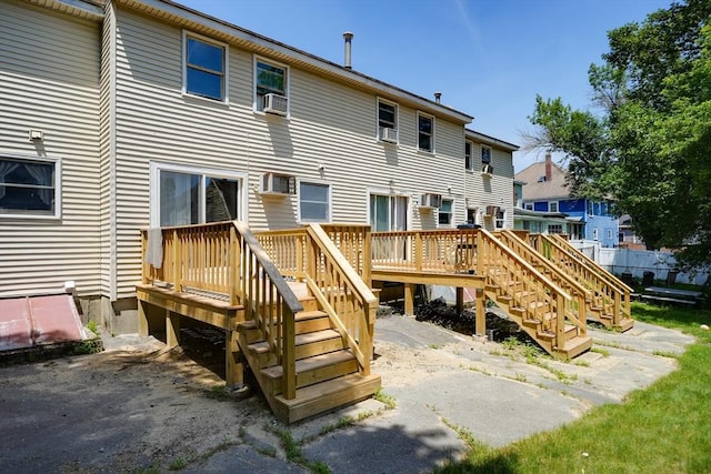 25 Sutherland St, Lowell, MA 01850 - back of property with a deck, stairway, a residential view, and cooling unit