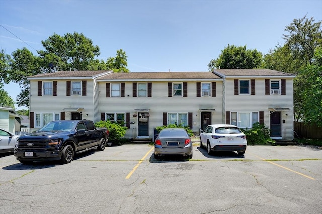 25 Sutherland St, Lowell, MA 01850 - townhome / multi-family property featuring uncovered parking