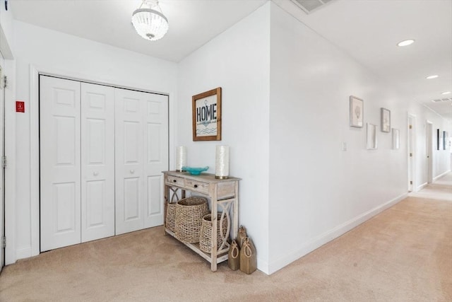 hall featuring light colored carpet, recessed lighting, and baseboards