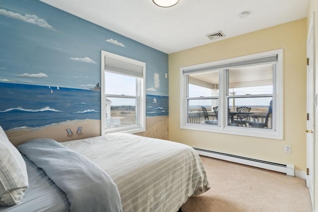 bedroom with a baseboard radiator and carpet floors