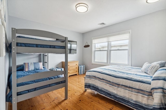 bedroom featuring wood finished floors