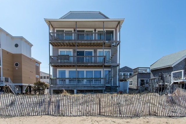 raised beach house with a balcony