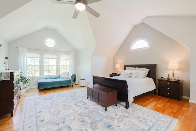 bedroom with multiple windows, vaulted ceiling, light wood-type flooring, and ceiling fan