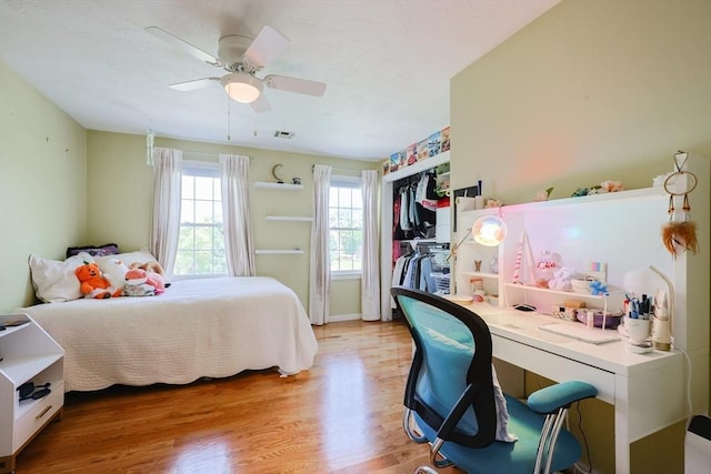 bedroom featuring light wood-style flooring and ceiling fan