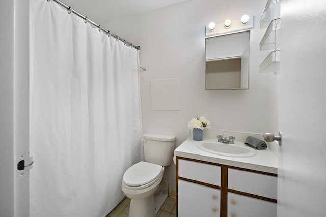 bathroom with a shower with curtain, vanity, toilet, and tile patterned flooring