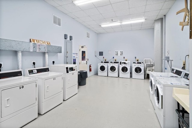 laundry area featuring washing machine and clothes dryer