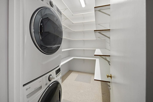 laundry room featuring stacked washing maching and dryer