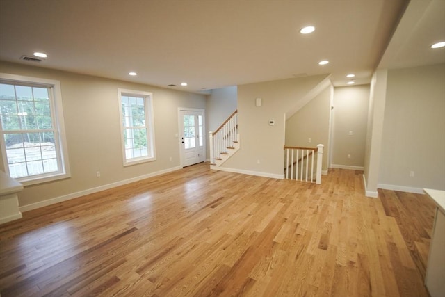 140 Tispaquin St, Middleboro, MA 02346 - unfurnished living room with recessed lighting, light wood-type flooring, and baseboards
