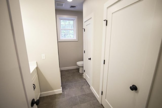 140 Tispaquin St, Middleboro, MA 02346 - bathroom with vanity, toilet, baseboards, and tile patterned flooring
