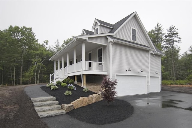 140 Tispaquin St, Middleboro, MA 02346 - view of home's exterior with a porch, an attached garage, driveway, and stairs