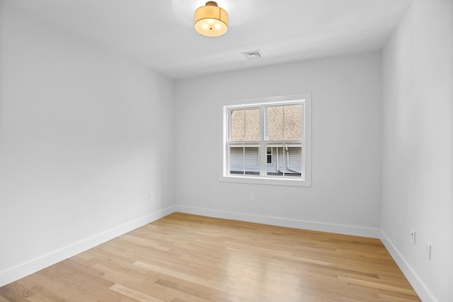 spare room with light wood-type flooring