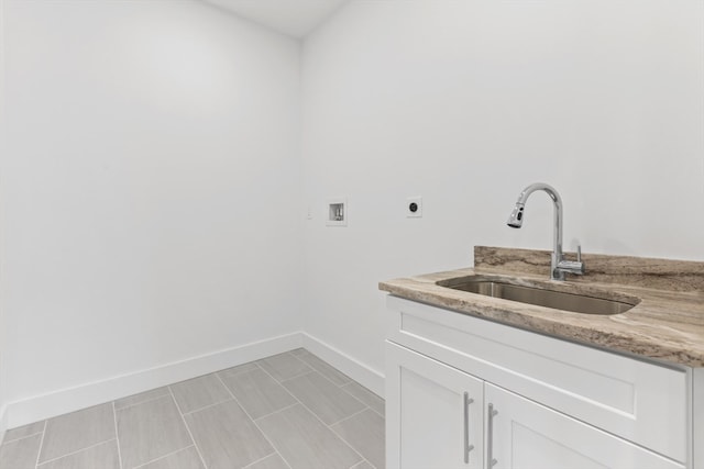 clothes washing area featuring cabinets, washer hookup, sink, and electric dryer hookup