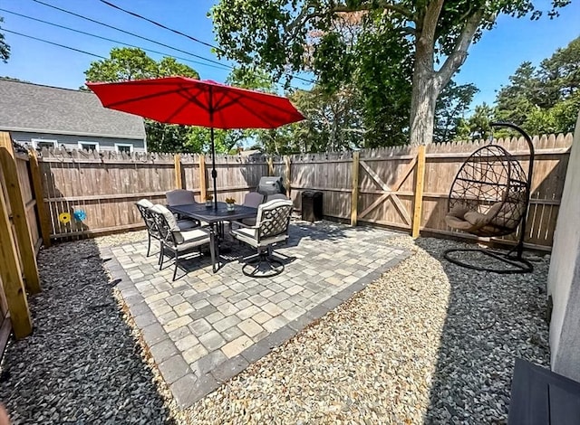 31 Northern Ave, Dennis, MA 02639 - fenced backyard with a patio area and outdoor dining space