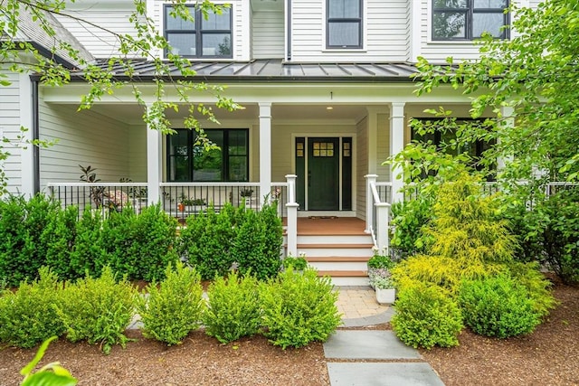 1 Putnam Rd, Bedford, MA 01730 - property entrance with a standing seam roof, a porch, and a metal roof