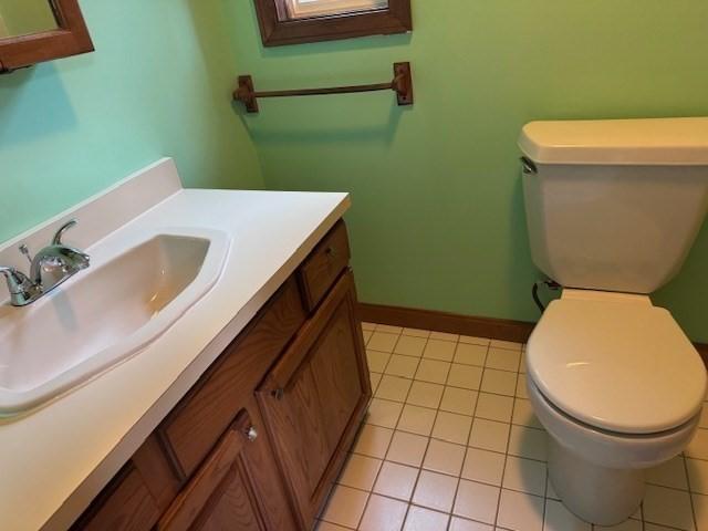 30 Wallace Cir Unit 30, Malden, MA 02148 - bathroom with toilet, vanity, tile patterned flooring, and baseboards