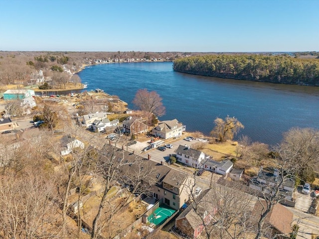 bird's eye view with a forest view and a water view