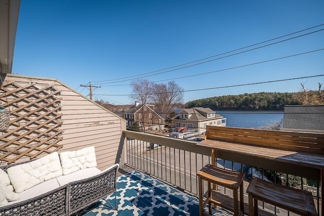 balcony featuring a water view