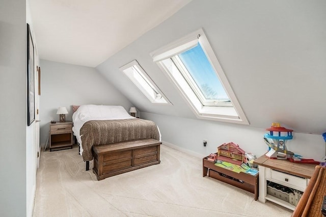 bedroom featuring baseboards, lofted ceiling, and light colored carpet